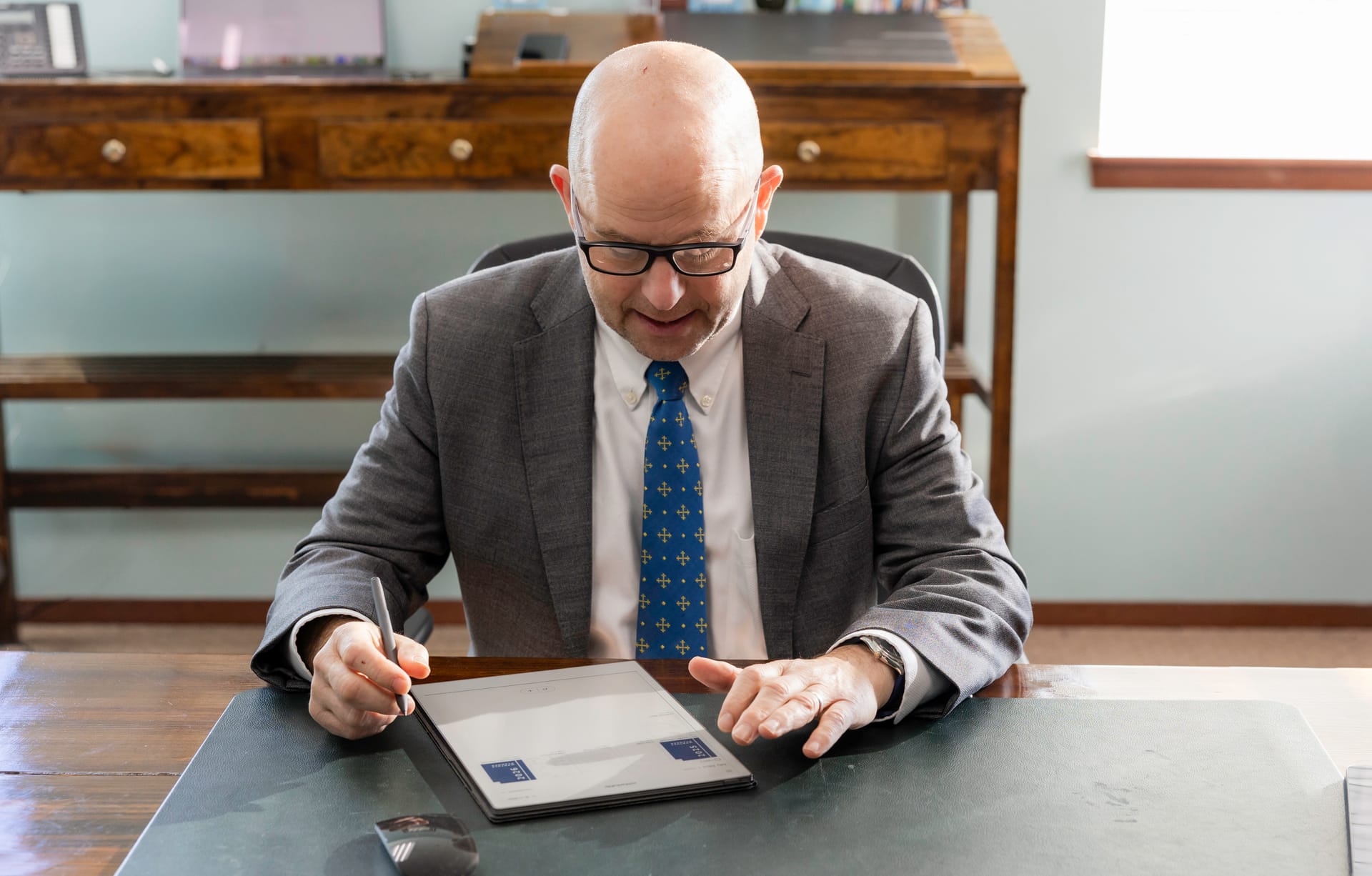 Managing Partner David P. Horton working at his desk in the Kitsap Law Group office