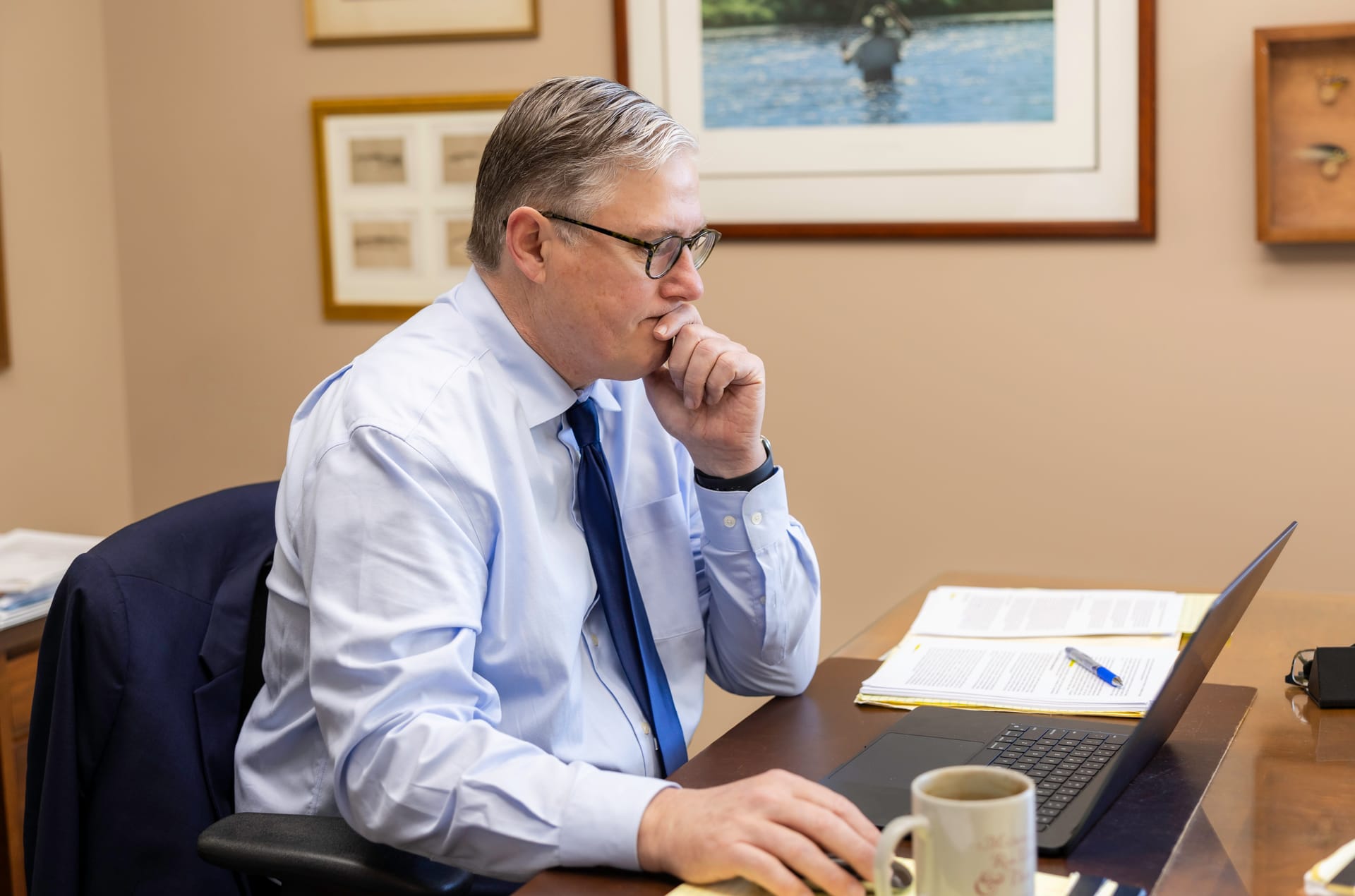 Attorney David A. Weibel at his desk in the Kitsap Law Group office