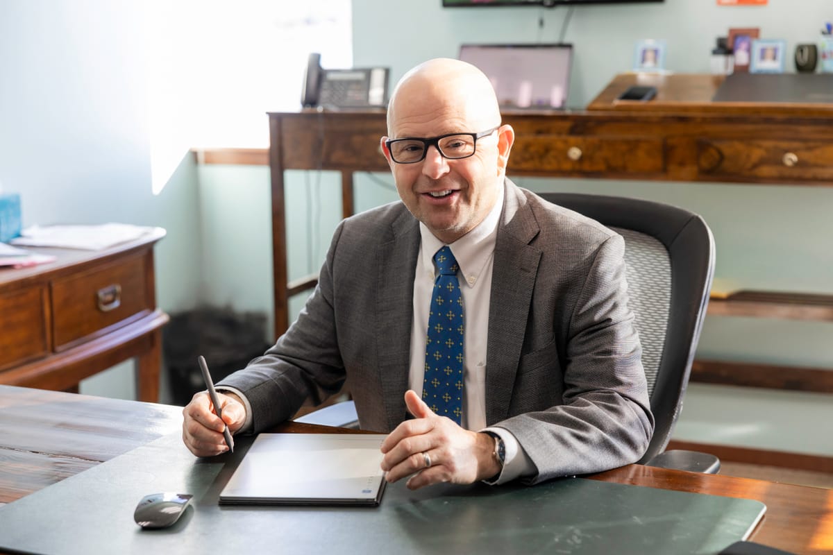 Managing Partner David P. Horton working at his desk in the Kitsap Law Group office